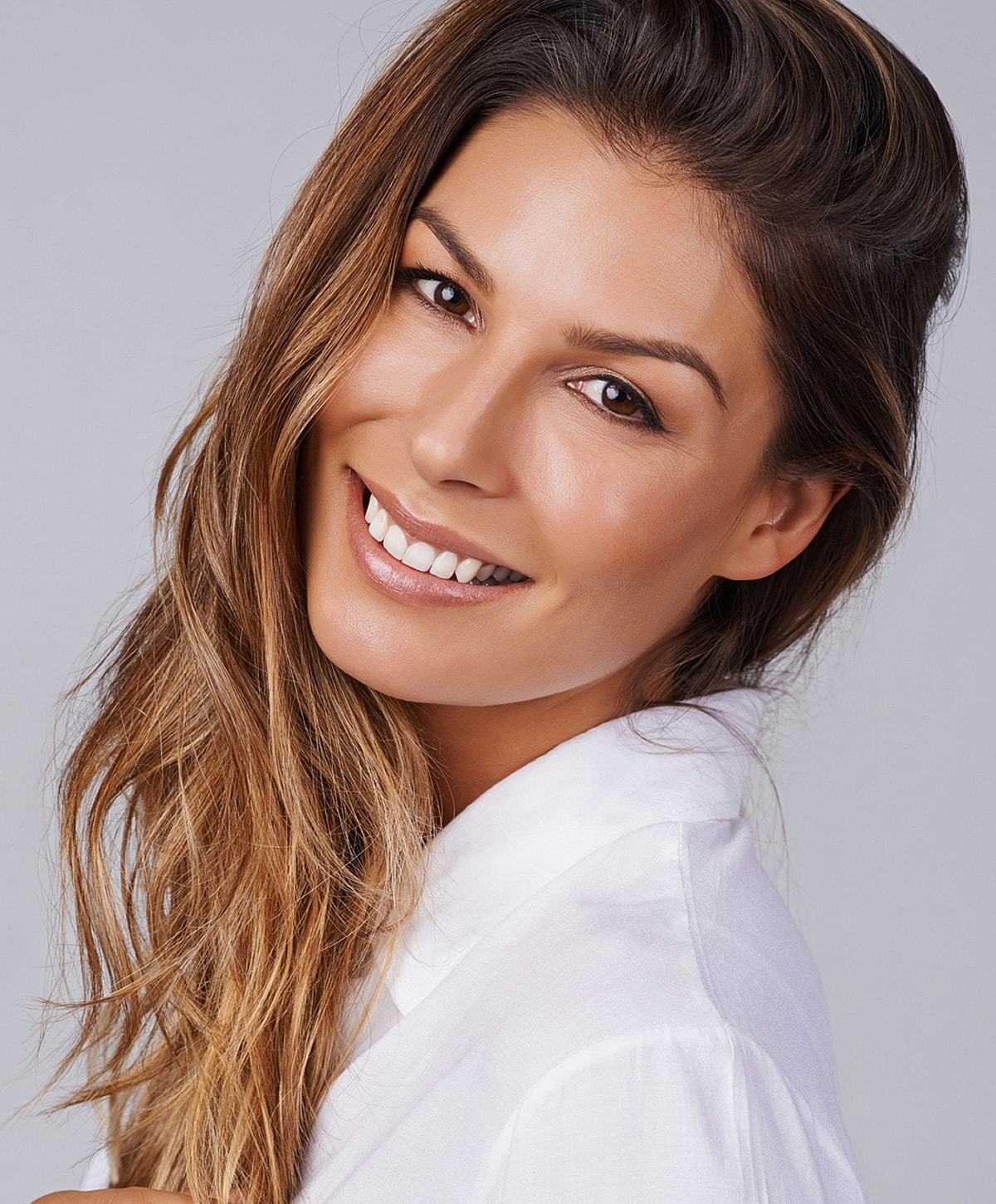 Woman in white lace lingerie near window.