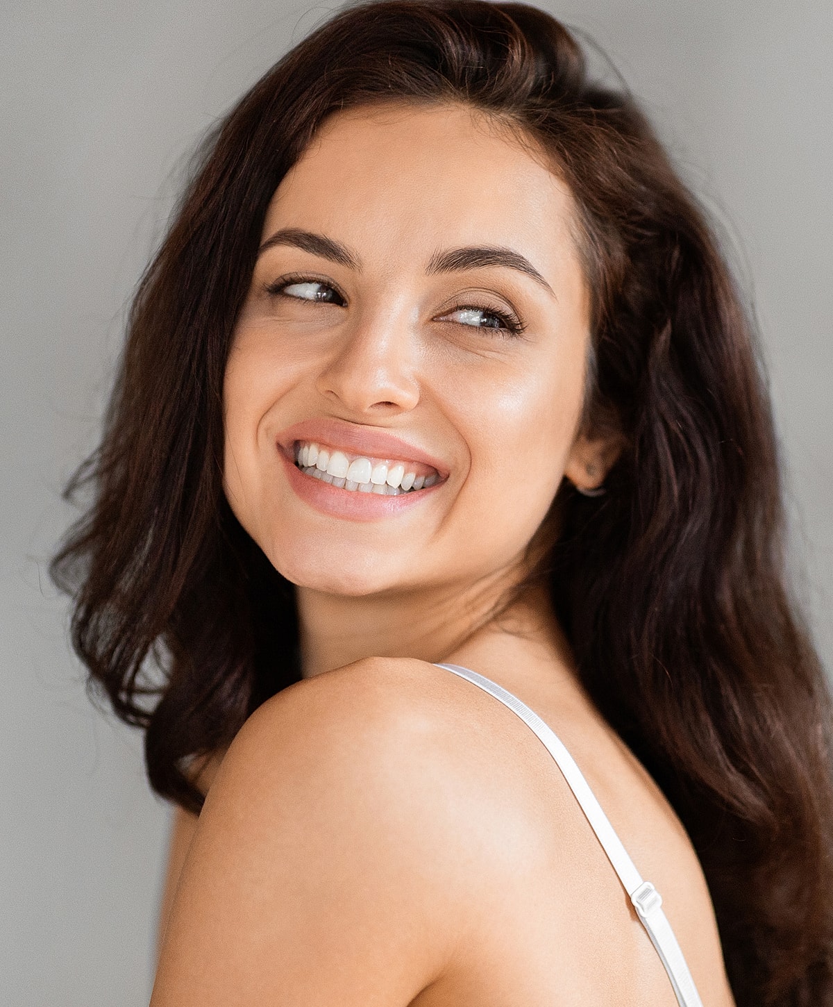 Close-up of a woman with soft makeup.
