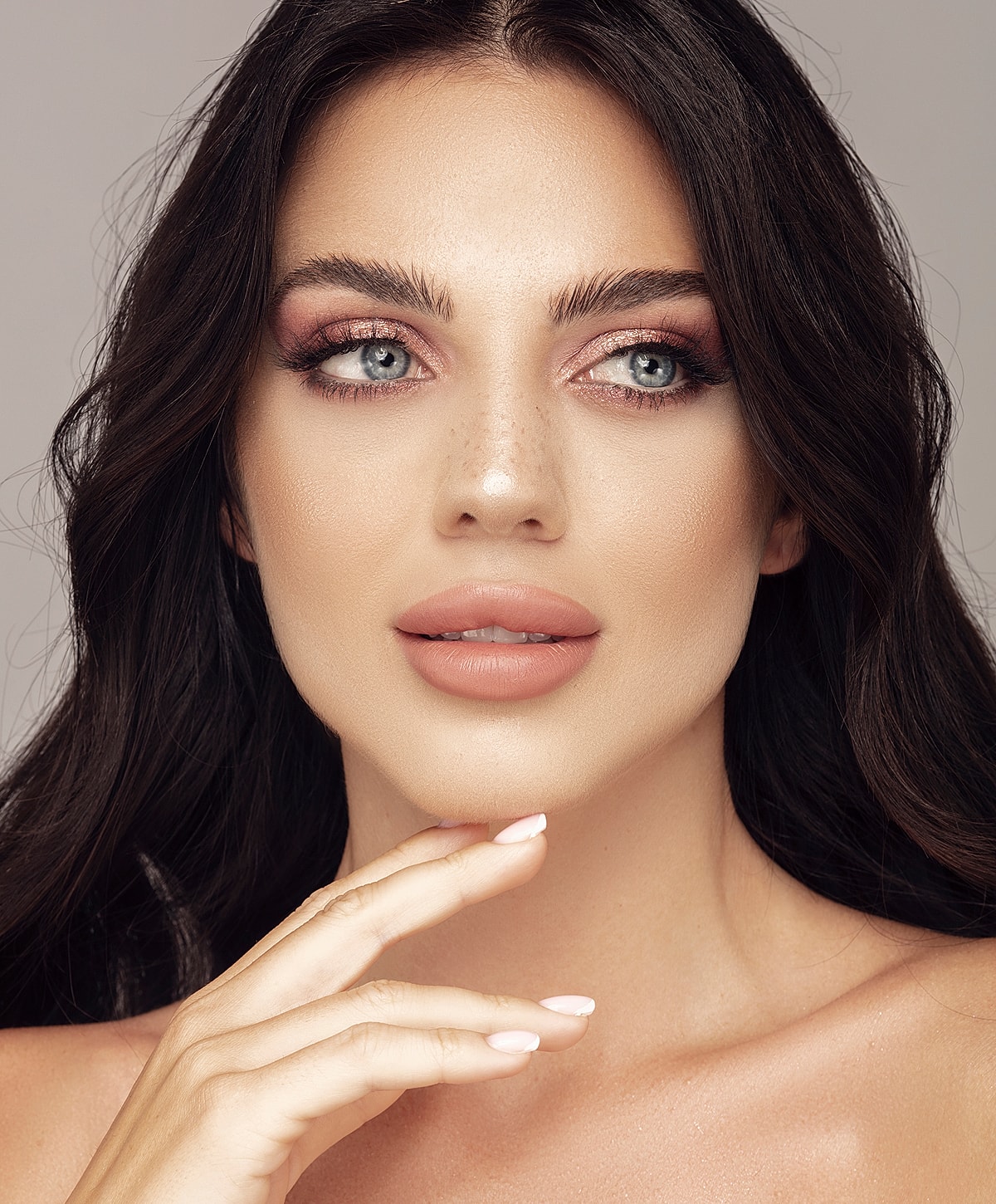 Close-up of a woman with soft makeup.