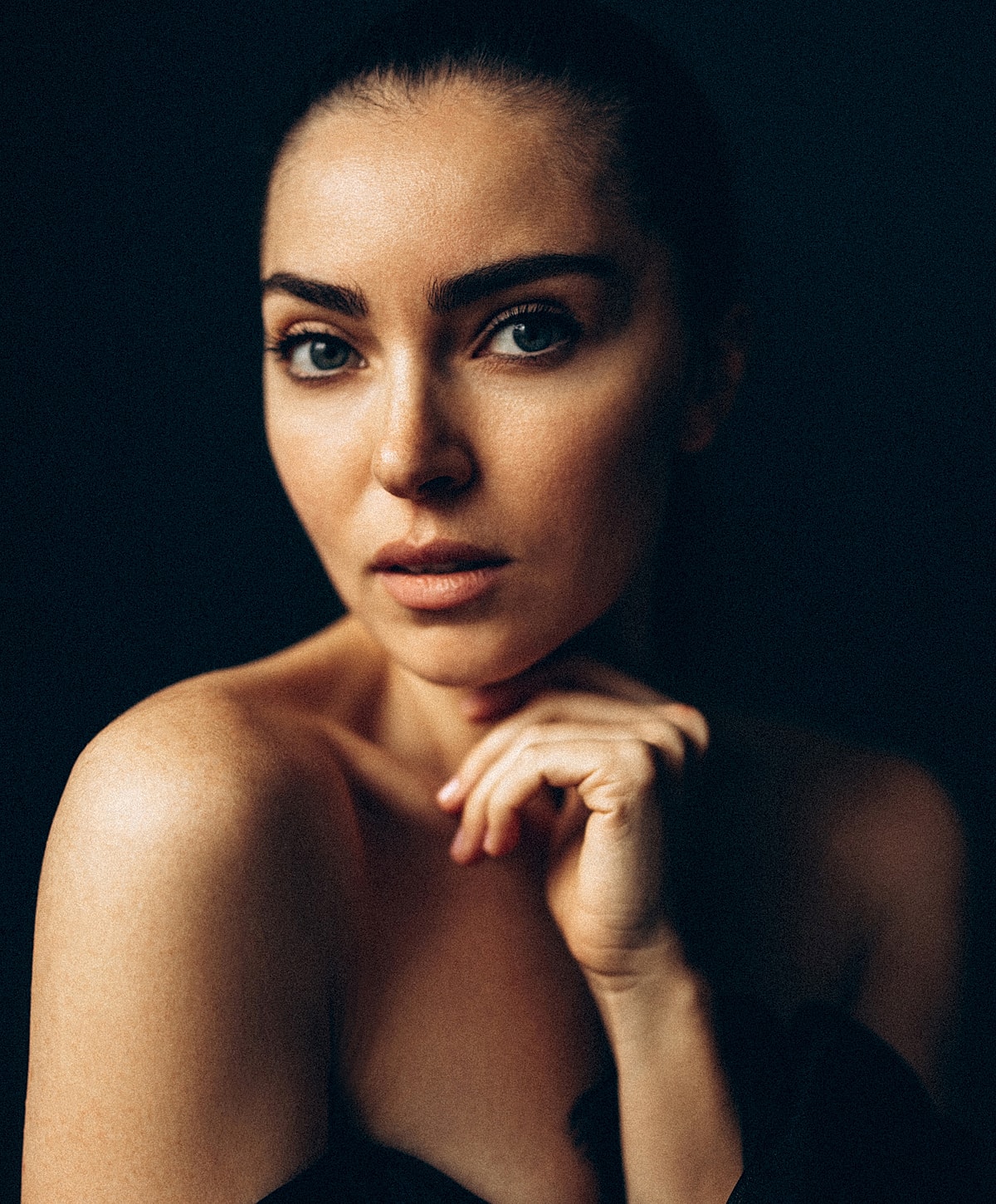 Close-up of a woman with soft makeup.