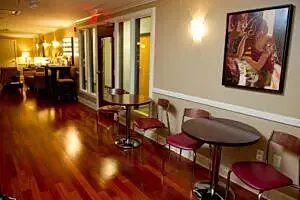 Cozy interior with wooden floors and artwork.