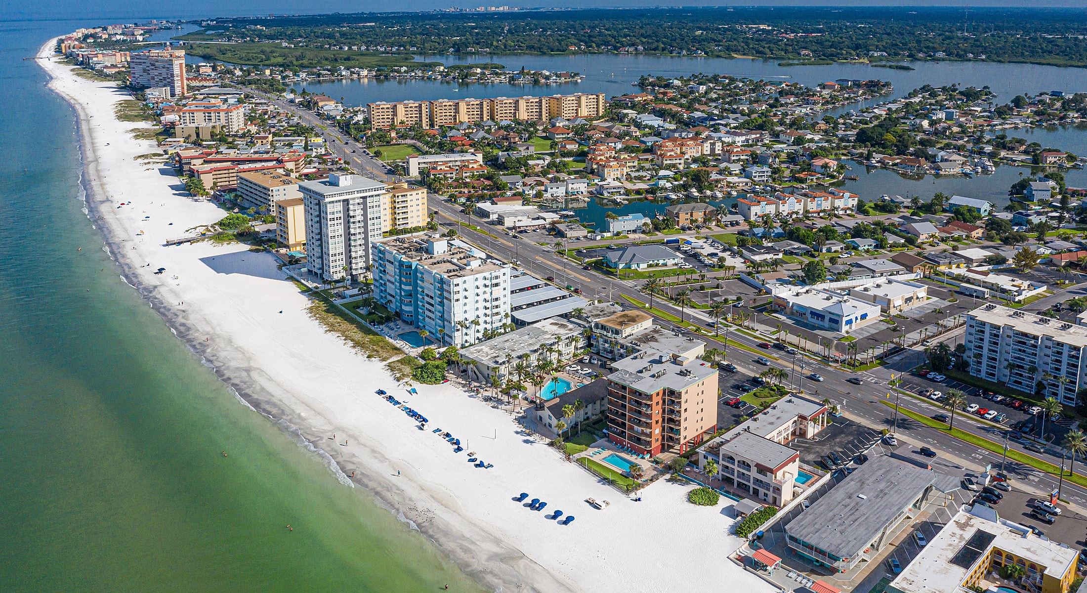 Coastal aerial view of residential beach community.